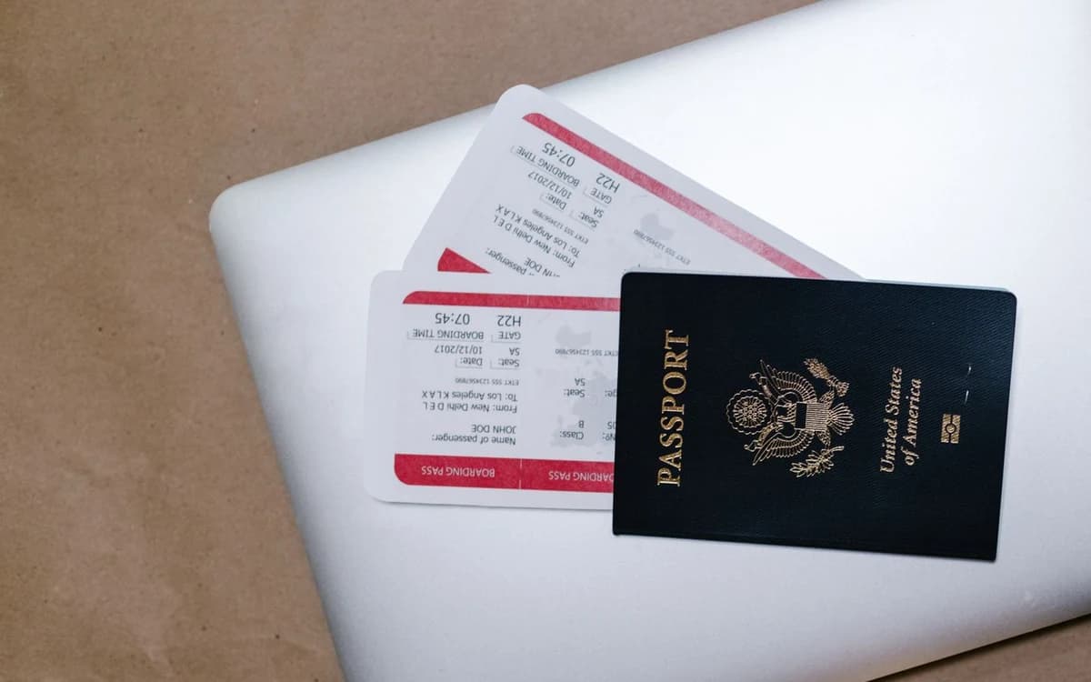 Passport and boarding passes on a laptop
